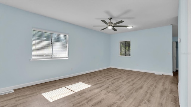 unfurnished room with ceiling fan and light wood-type flooring