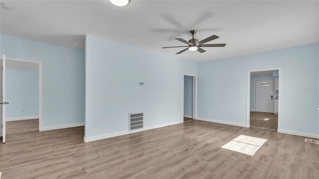 unfurnished room with ceiling fan and light hardwood / wood-style flooring