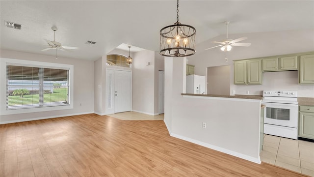 kitchen with light wood-type flooring, white appliances, ceiling fan with notable chandelier, green cabinetry, and lofted ceiling