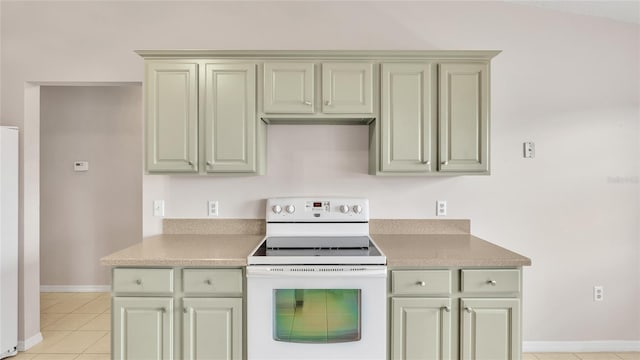 kitchen with light tile patterned floors and white electric stove