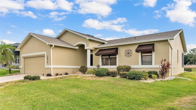 single story home with a garage and a front yard