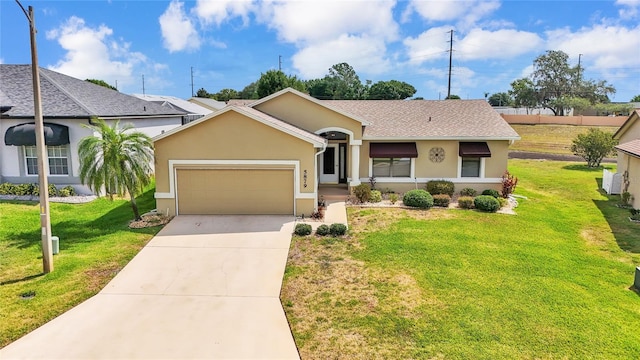 ranch-style house featuring a garage and a front yard