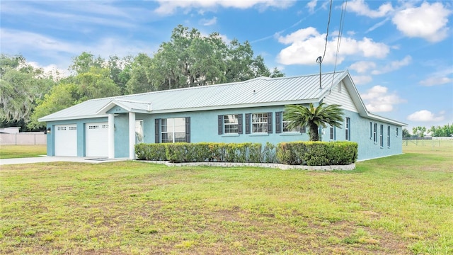 ranch-style home with a front yard and a garage