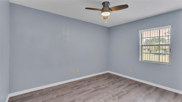 6110 Downing St, Dover, FL 33527 - unfurnished room featuring wood finished floors and a ceiling fan