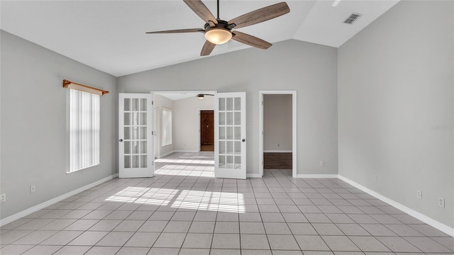 6110 Downing St, Dover, FL 33527 - empty room with french doors, ceiling fan, vaulted ceiling, and light tile patterned flooring
