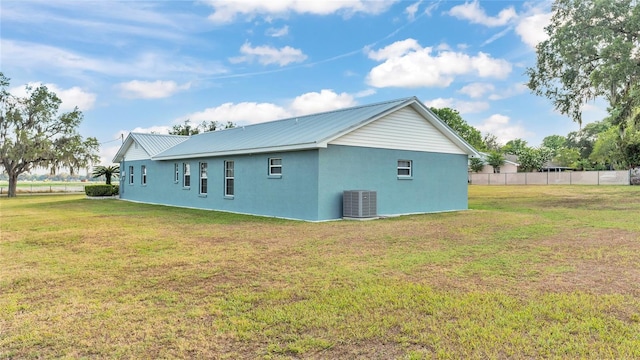 6110 Downing St, Dover, FL 33527 - view of property exterior with stucco siding and a metal roof