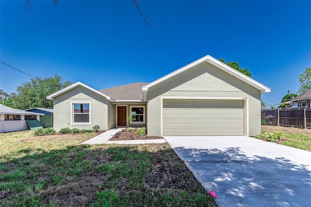 single story home featuring a garage and a front lawn