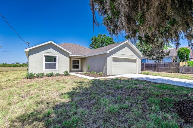 ranch-style home with a garage and a front lawn