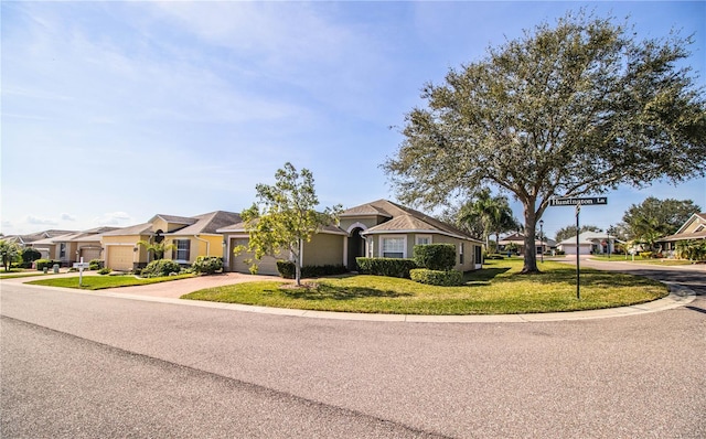 ranch-style home with a front lawn