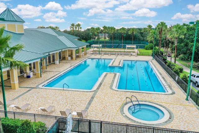 view of swimming pool with a community hot tub and a patio area