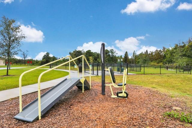 view of jungle gym with a lawn