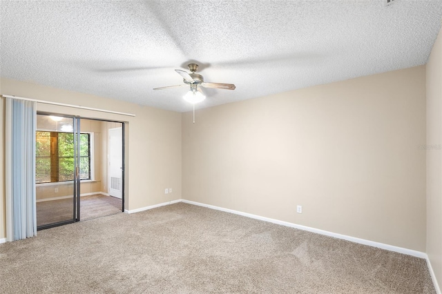 empty room featuring carpet flooring, a textured ceiling, and ceiling fan