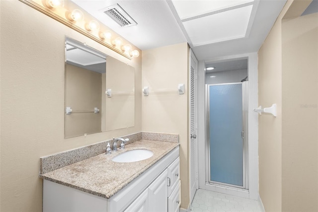 bathroom featuring walk in shower and vanity