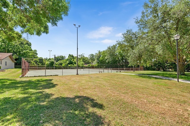 view of yard featuring tennis court