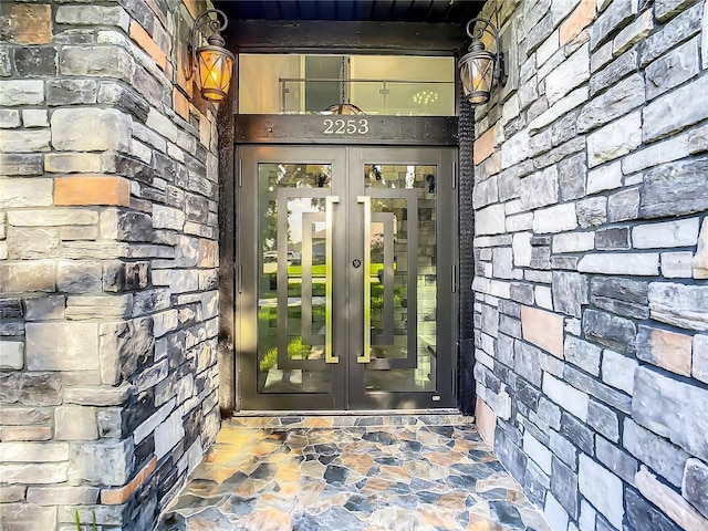 view of exterior entry featuring french doors