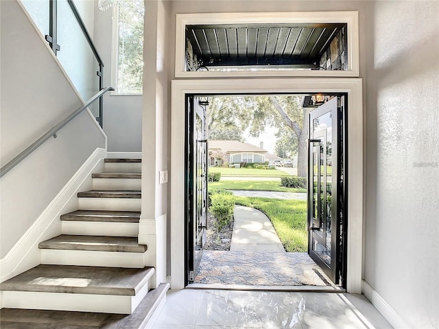 foyer entrance featuring plenty of natural light