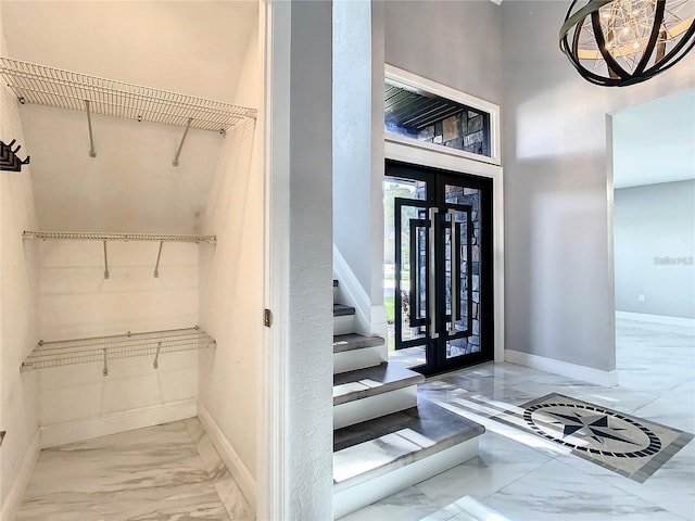 interior space featuring a high ceiling and french doors