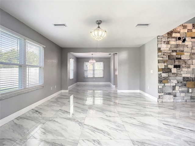 empty room with a chandelier
