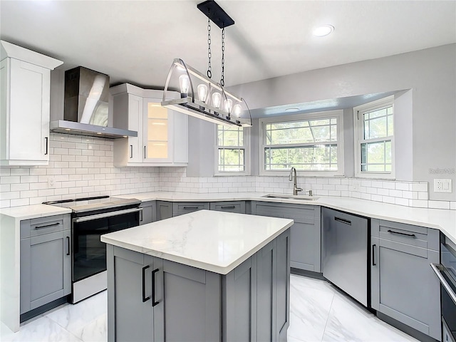 kitchen with wall chimney exhaust hood, sink, electric range oven, stainless steel dishwasher, and white cabinets