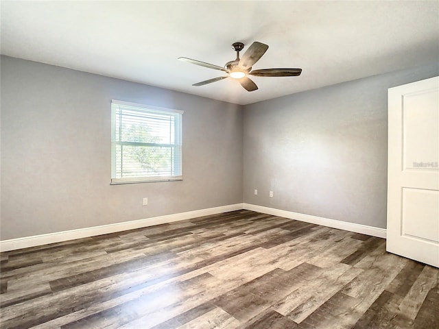 empty room featuring ceiling fan and hardwood / wood-style floors