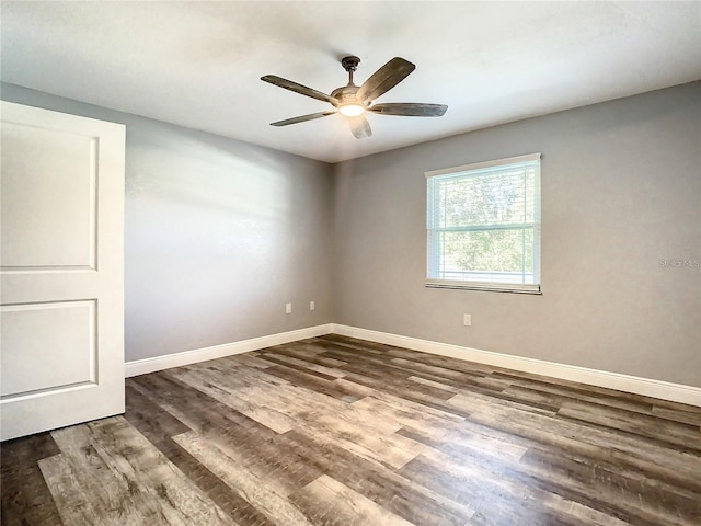 empty room with ceiling fan and wood-type flooring