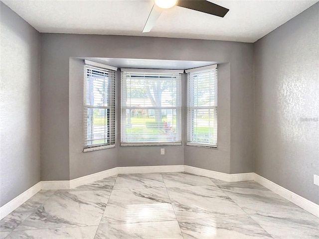 spare room featuring ceiling fan