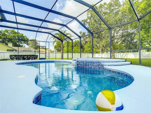 view of swimming pool featuring a lanai, pool water feature, and a patio area