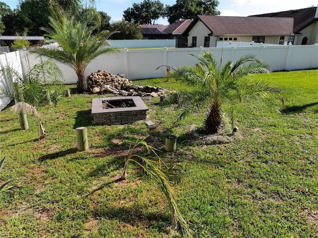 view of yard with a fire pit