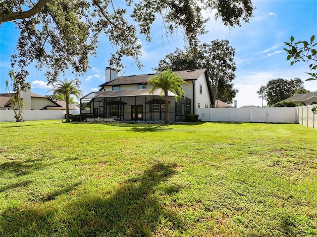 view of yard with a lanai