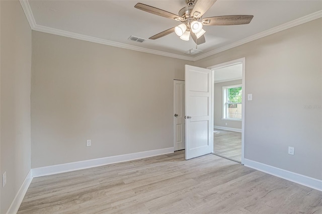 unfurnished room featuring ceiling fan, crown molding, and light hardwood / wood-style floors