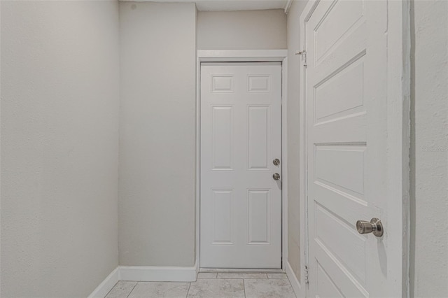 doorway featuring light tile patterned floors