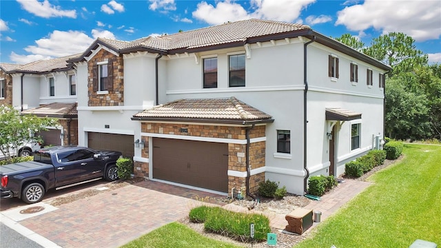 view of front of house with a garage and a front yard