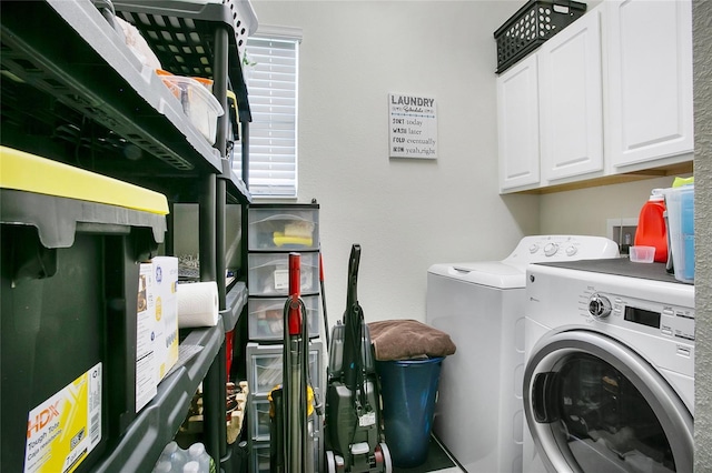 washroom with cabinets and independent washer and dryer