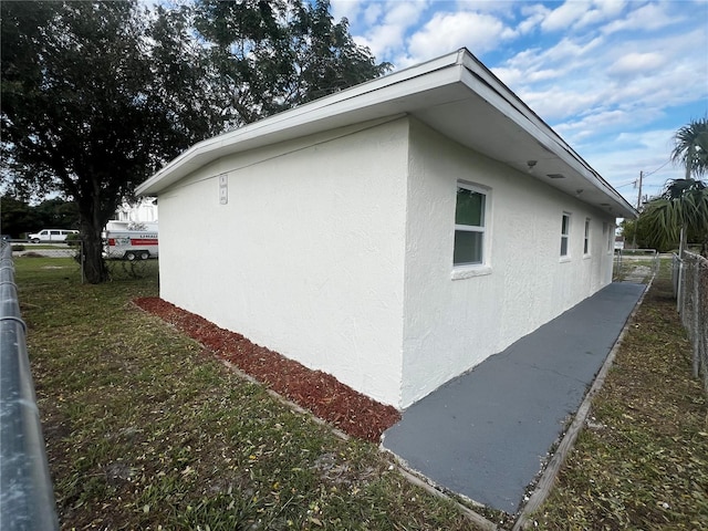 view of home's exterior with a lawn