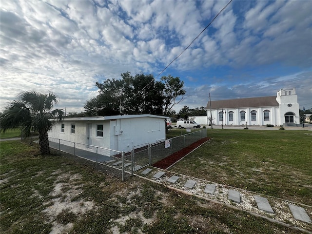 view of side of property with a yard