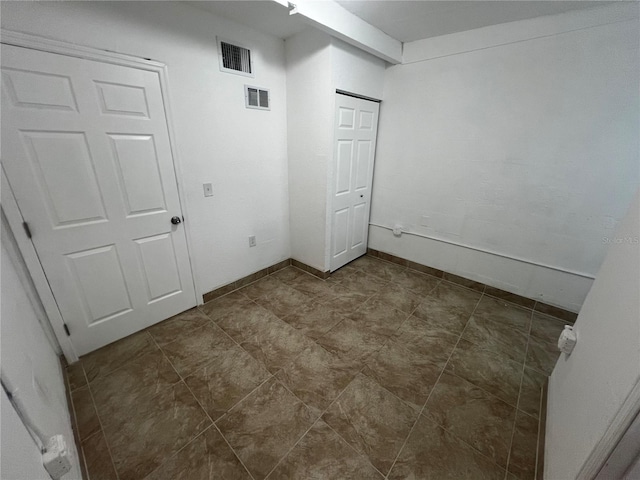 unfurnished bedroom featuring a closet