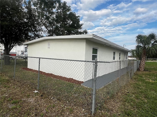 view of property exterior with a yard