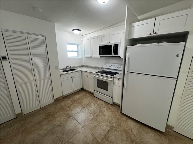 kitchen with white cabinets, white appliances, and sink