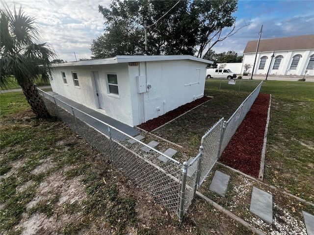 view of home's exterior featuring a lawn