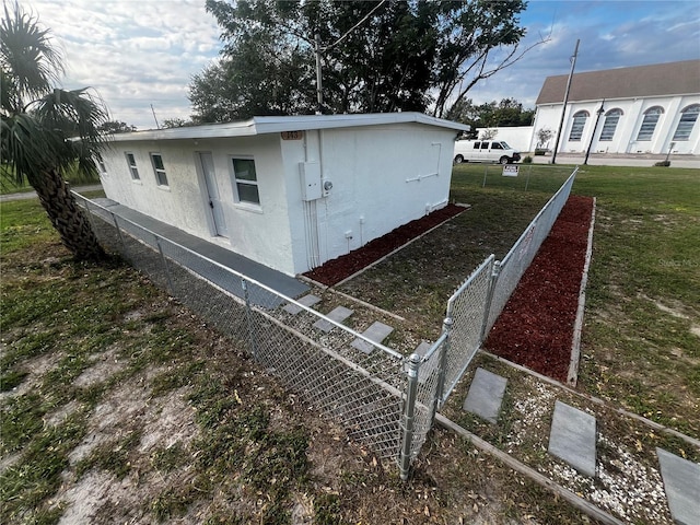 view of property exterior featuring a yard