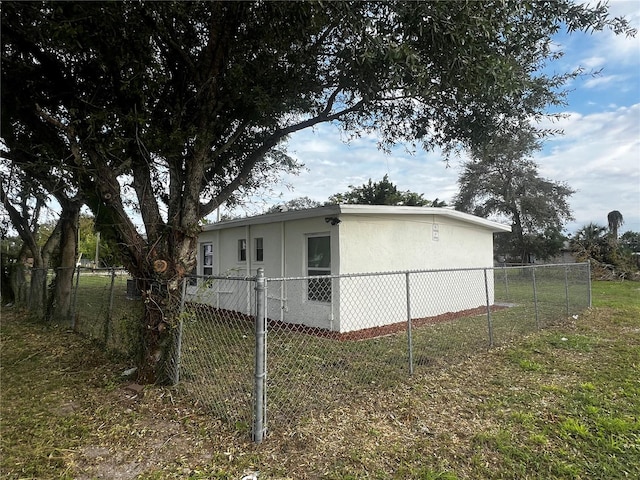 view of side of property with a yard