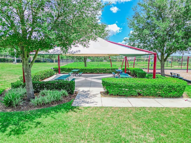 view of home's community with a yard