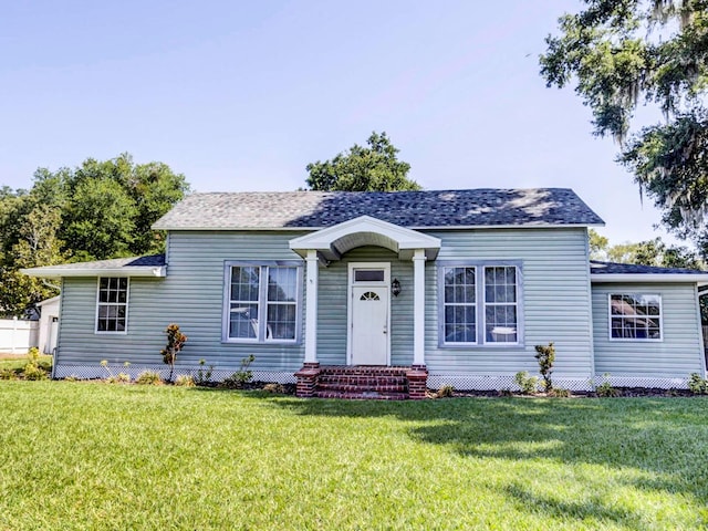 view of front of property with a front lawn