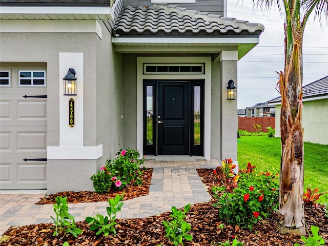 doorway to property featuring a garage