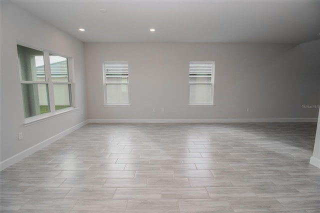 spare room with light tile floors