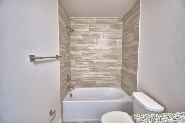 bathroom featuring toilet and shower / bath combination