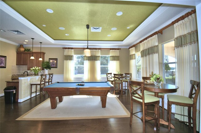 playroom featuring a tray ceiling, visible vents, and dark wood-type flooring