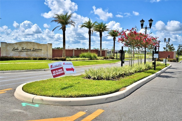 exterior space featuring street lights and curbs