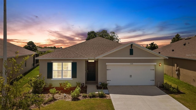 view of front of home featuring a garage, concrete driveway, roof with shingles, and stucco siding