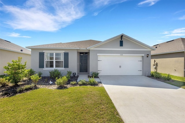 ranch-style home with concrete driveway, roof with shingles, an attached garage, a front lawn, and stucco siding